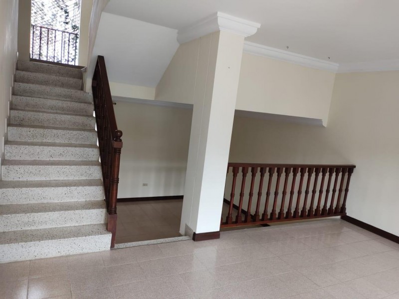 View of staircase to upstairs, staircase to dining room/kitchen
